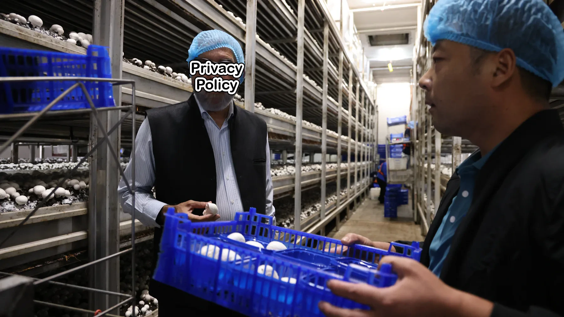 Brazilian academician reviewing products during a biotechnology facility visit in Guannan