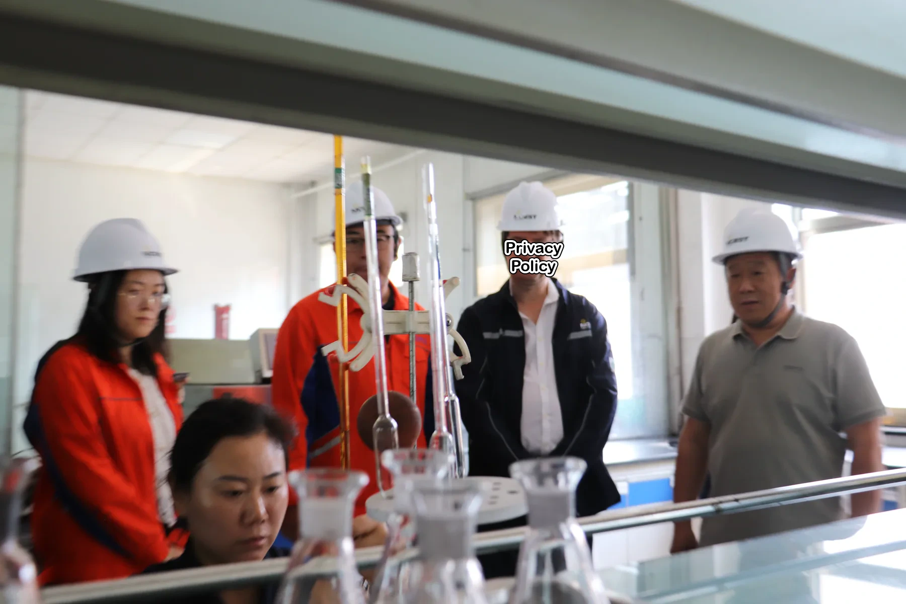 Expert reviewing laboratory equipment and operating conditions